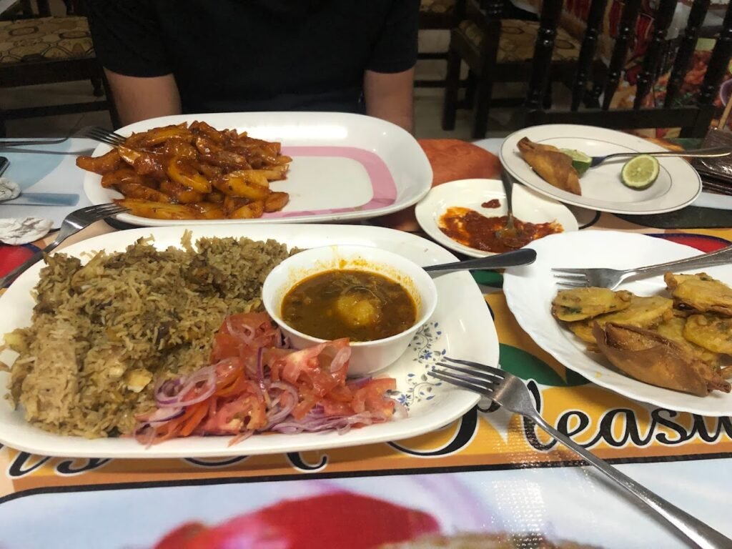 Pilau with a side of stir fried potatoes coast dishes diani beach
